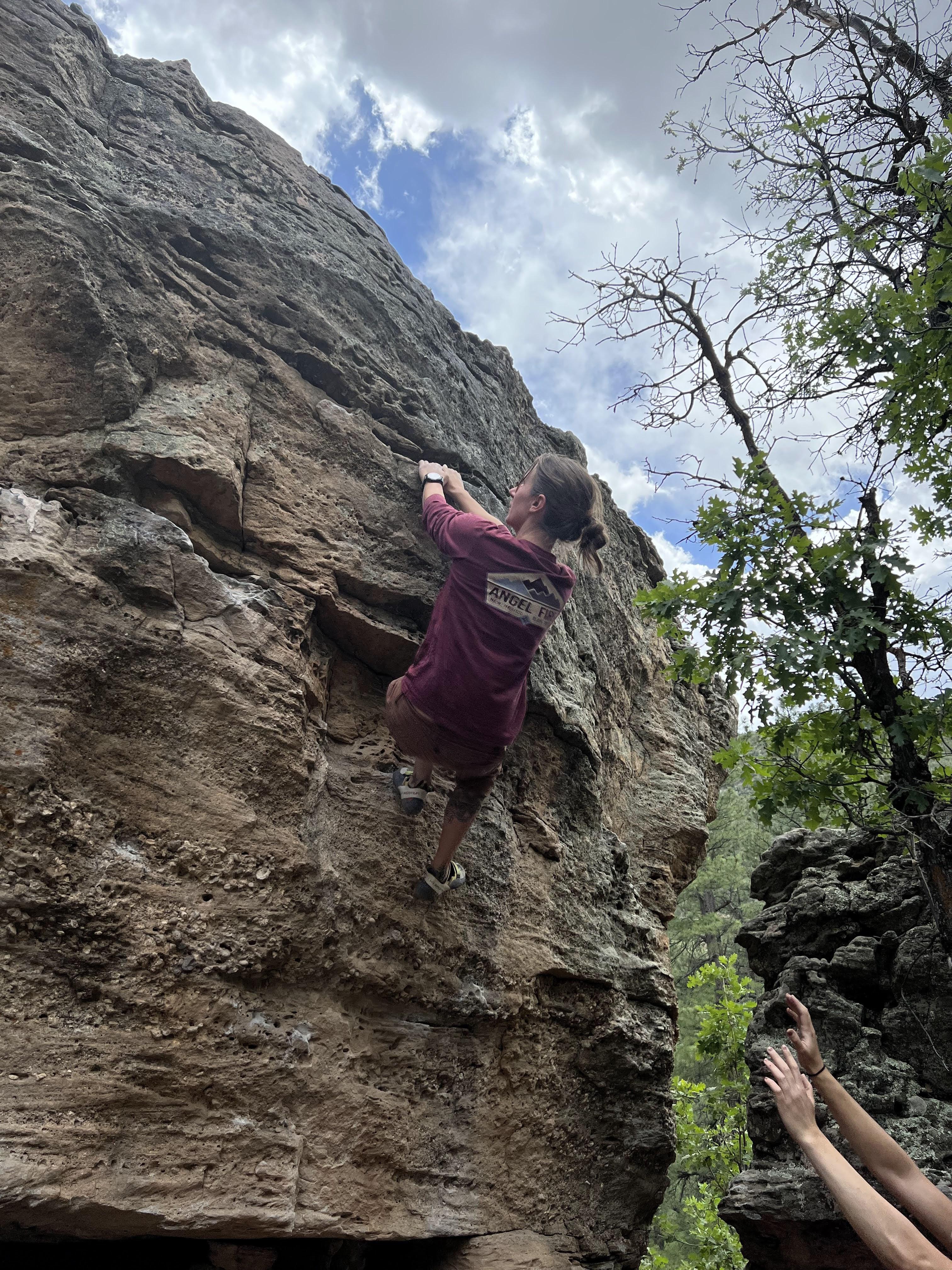 /images/emily-smashing-boulder.jpg